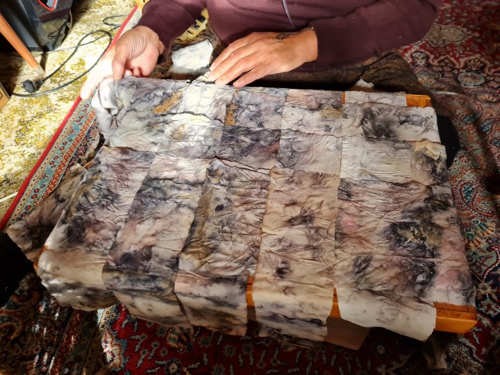 Maata working on the ecodyed canvas